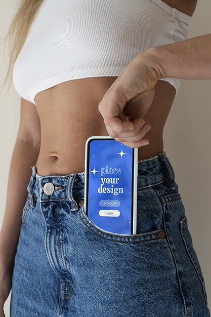 Woman hand holding smartphone mock-up indoors